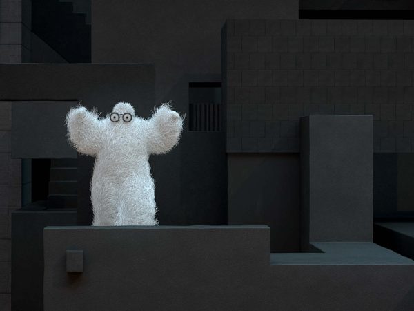 En 3D-modellerad vit fluffig figur dansar i en svart miljö gjord av olika kantiga former.